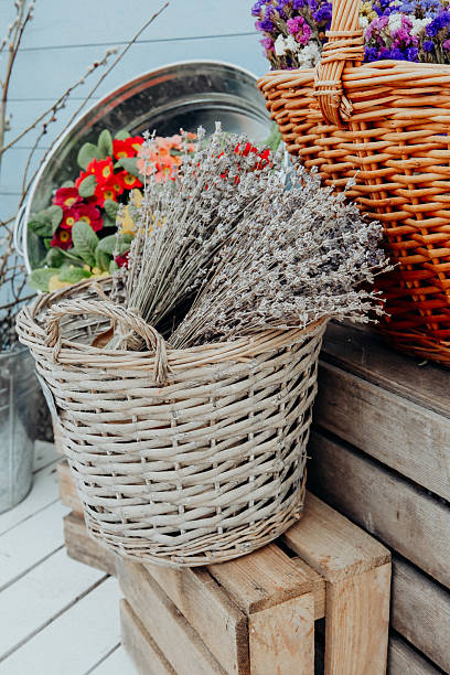 istock Flower arrangement with lavender and colorful blooms in rustic baskets 2232330215