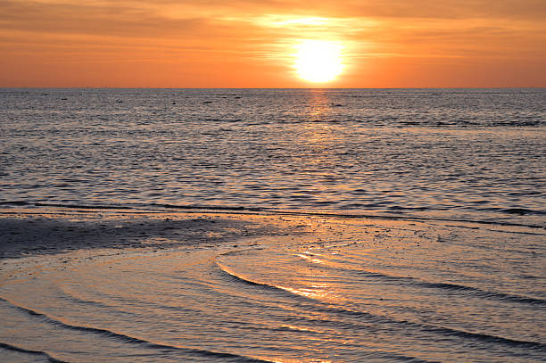 istock Sunset over the sea, golden light reflections and silent expanse 2232330846