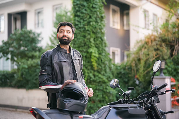 istock Man preparing for motorcycle ride outdoors 2232332009