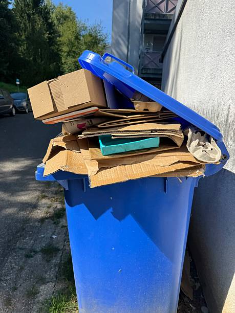 istock The Blue Recycling Bin is currently overflowing with cardboard waste that needs attention 2232332162