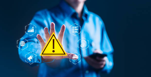 istock Businessman Tapping Risk Alert Symbol for Cautious Risk Management Strategy 2232333281