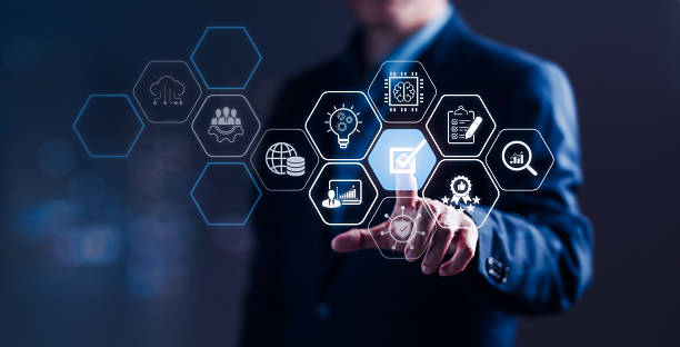 istock Businessman Pointing at Quality Control Icons for Systematic Management Standards 2232333470