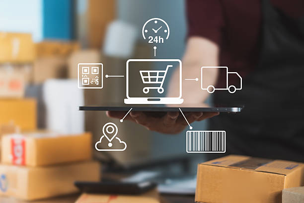 istock E-commerce seller holding tablet with icons representing 24/7 online shopping, barcode tracking, delivery, and smart logistics system 2232333865