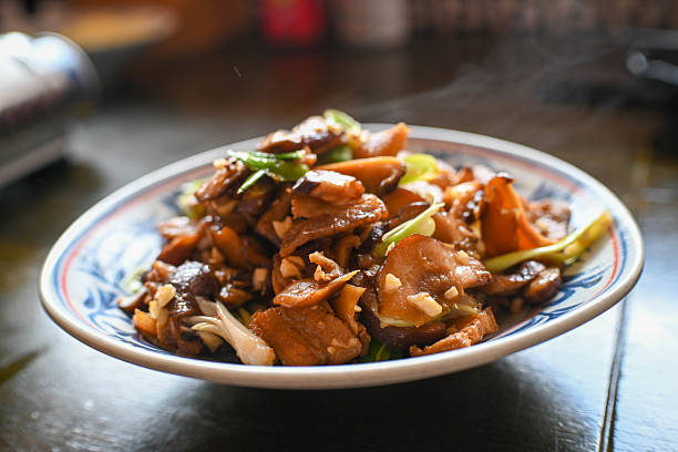 Cloud Ear Jellyfish or Stir Fried Wood Ear Mushrooms served in plate isolated on wooden table side view of hong kong food