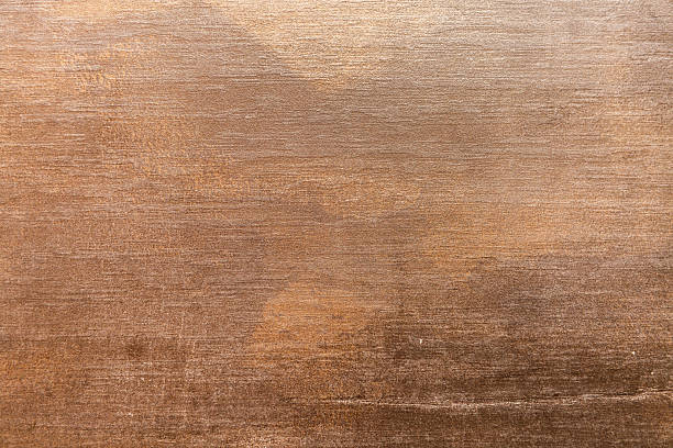 istock Textured brown surface with abstract patterns and gradients in natural lighting 2232335966