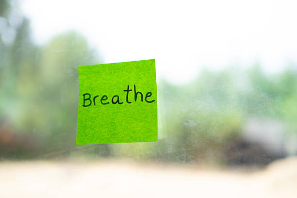 istock Green sticky note reminding to breathe on window 2232336564