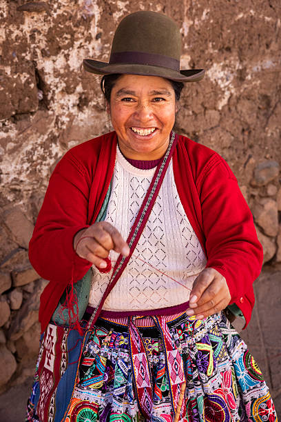 istock Peruvian woman spinning a wool in Pisac, Urubamba Valley 2232339140