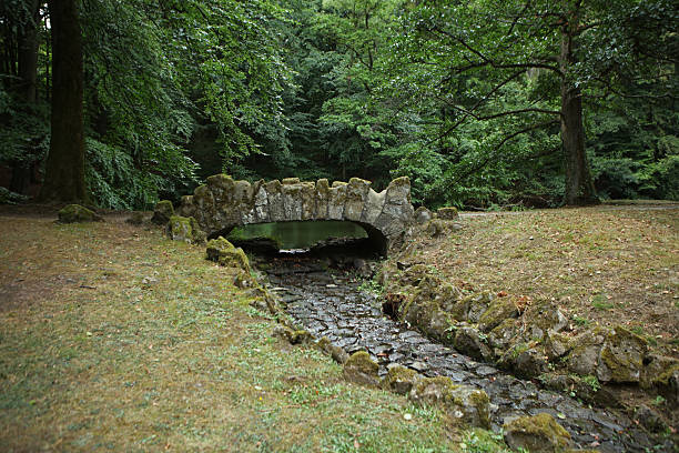 Small stone bridge in Pavilion in landscape park Bergpark, Kassel, Germany