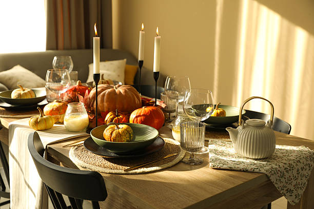 istock Stylish table setting with beautiful autumn decor in dining room 2232345171