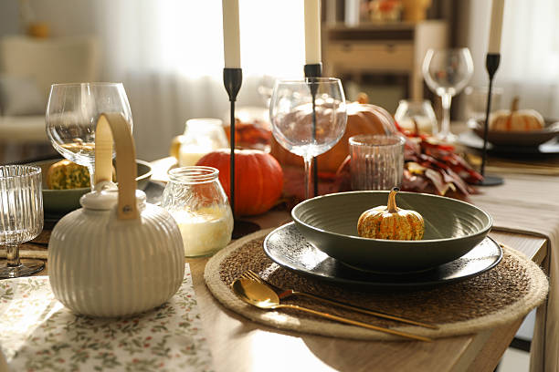 istock Stylish table setting with beautiful autumn decor in dining room 2232345175