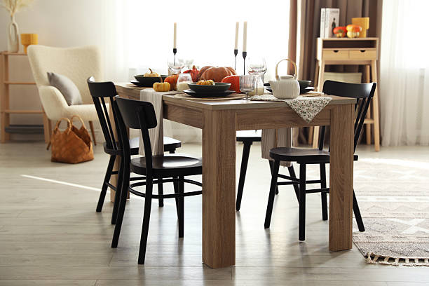 istock Stylish dining room with beautiful table setting and autumn decor 2232345176