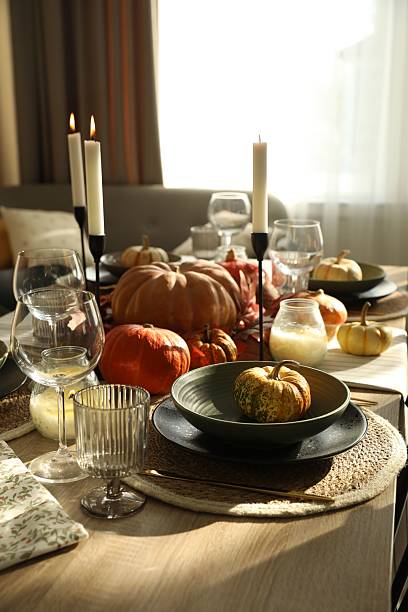 istock Stylish table setting with beautiful autumn decor in dining room 2232345182