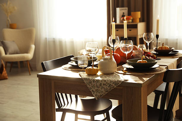 istock Stylish table setting with beautiful autumn decor in dining room 2232345197