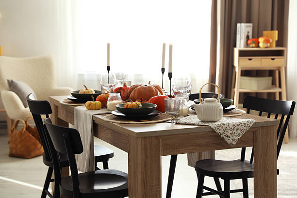 istock Stylish table setting with beautiful autumn decor in dining room 2232345262