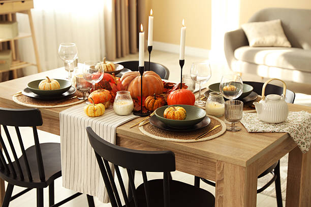 istock Stylish table setting with beautiful autumn decor in dining room 2232345285