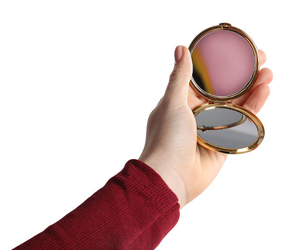 istock Woman holding pocket mirror on white background, closeup 2232345909