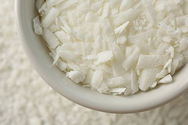 istock Soy wax in bowl on pile, top view 2232346243