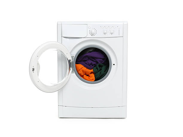 istock Modern washing machine with clothes in drum isolated on white 2232349080