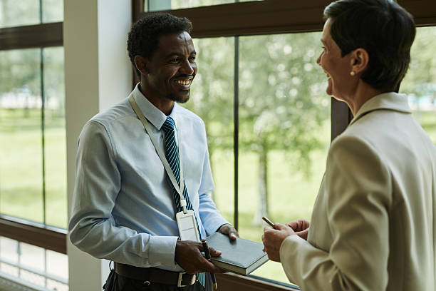 istock Diverse Business People Talking by Office Window 2232352294