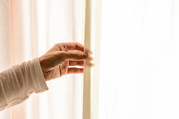 istock The hand behind the curtain 2232352380