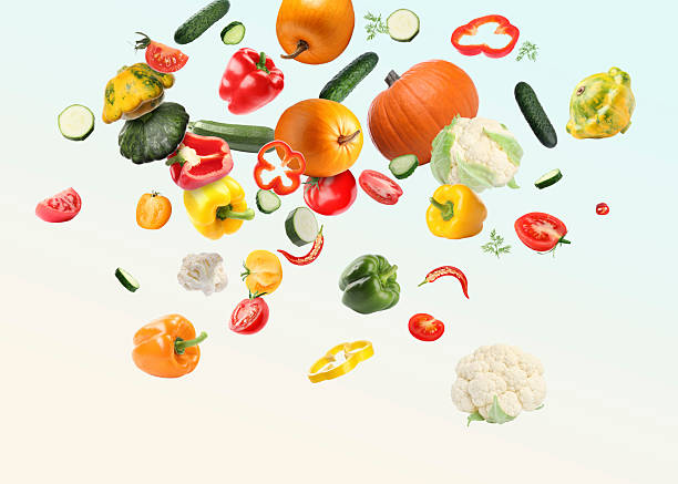 istock Many different fresh vegetables in air on light background 2232353981