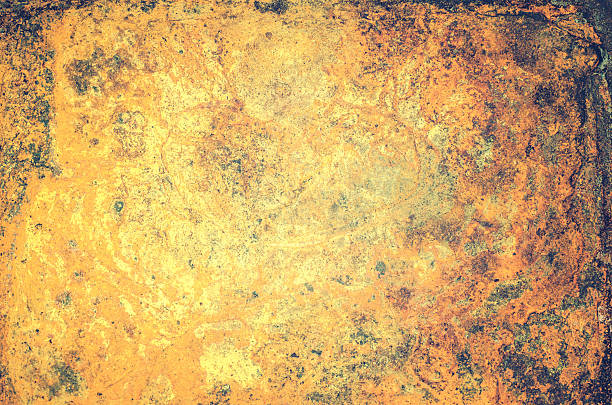 Art grunge textured background in golden colors.