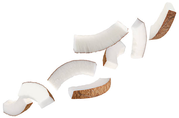 istock Thin semicircular slices of coconut fly in space forming a chain shape. Isolated on white 2232354237