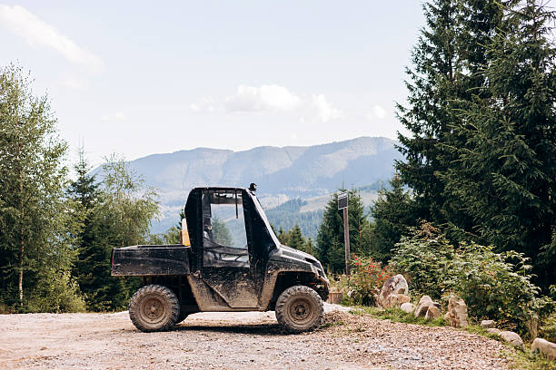 istock Off road utility vehicle on mountain trail with scenic forest view. 2232355148
