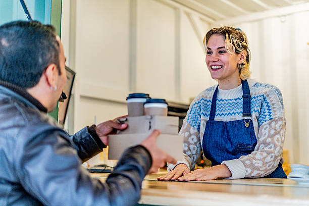 istock Waitress serving customer in a coffee shop 2232356489