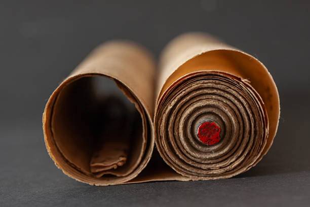 Top view of an isolated old package made of carton and tied with a string