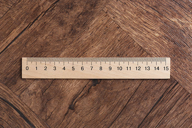 istock One ruler on wooden table, top view 2232357344