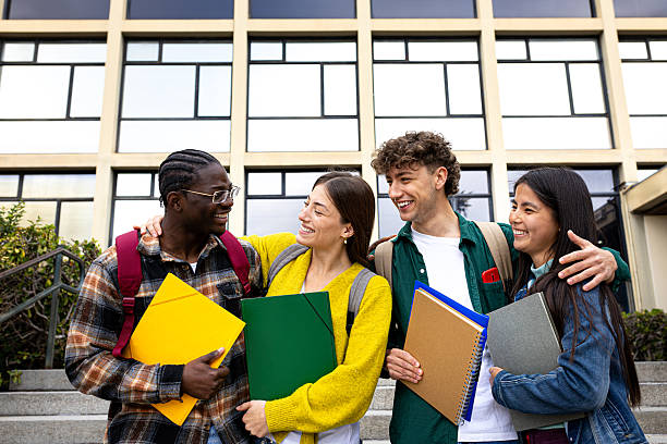 istock Happy multi-ethnic students hugging and smiling at university campus 2232359367