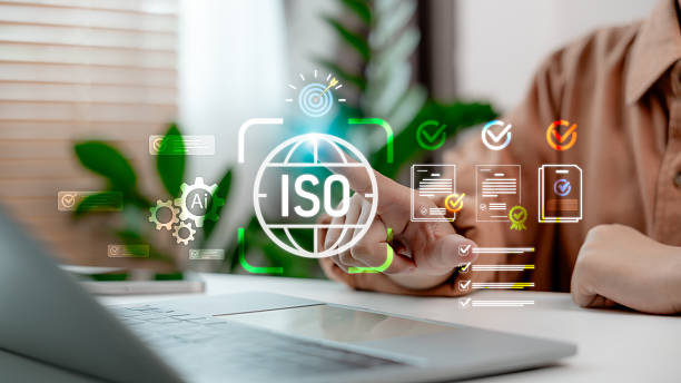 istock Businessman using laptop with ISO certification, AI technology, quality standard and compliance document management 2232359595