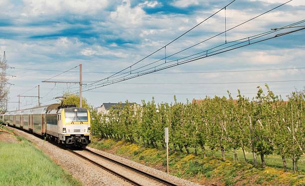 istock Movement of an electric train among fields in the countryside 2232360176