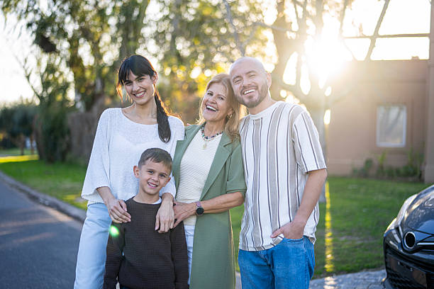istock Multi-generational family posing for photo in an outdoor setting. 2232360430