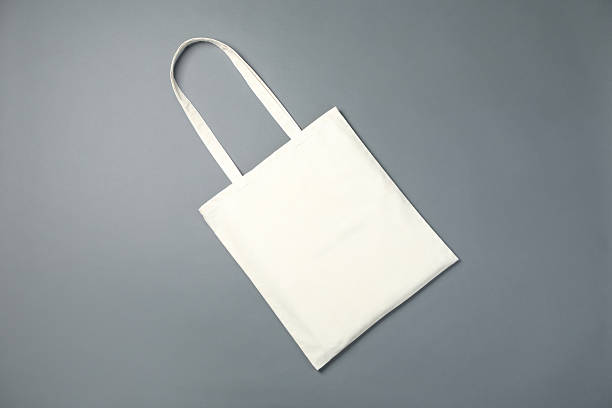 istock One shopping bag on grey background, top view. Mockup for design 2232362590