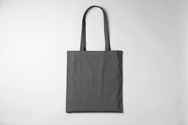 istock One shopping bag on grey background, top view. Mockup for design 2232362593