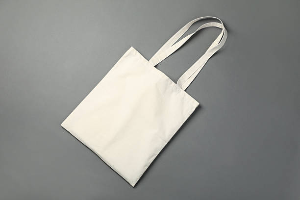 istock One shopping bag on grey background, top view. Mockup for design 2232362614