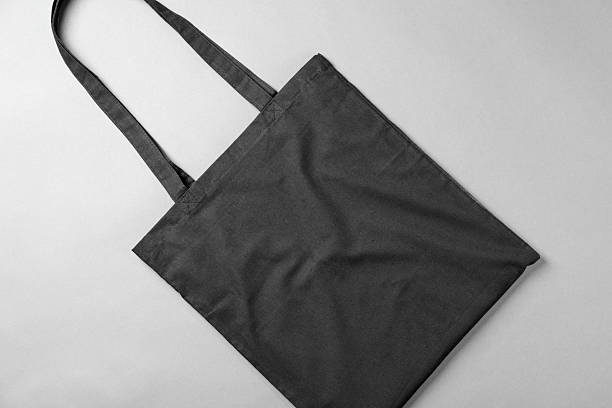 istock One shopping bag on grey background, top view. Mockup for design 2232362616