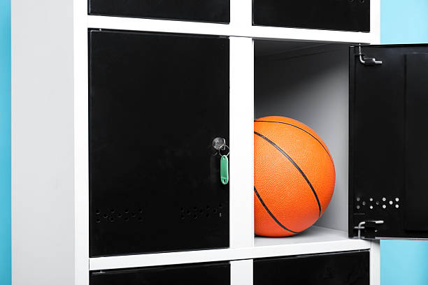 istock Open locker with basketball ball on light blue background, closeup 2232362946