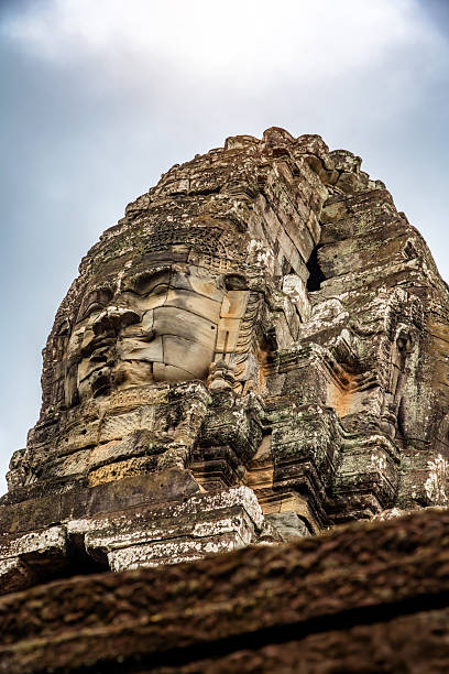 Shot in color detail on the facade of this historic building representing some character, animal or flower. Set at Siem Riep, Angkor Wat , Cambodia, Asia