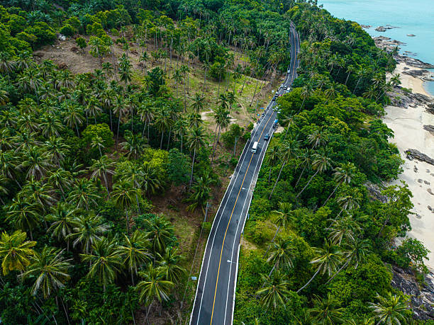 istock Aerial view asphalt road in tropical forest island 2232363790