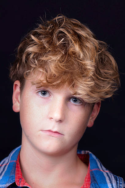 istock Boy of 12 wearing a checked shirt 2232369852