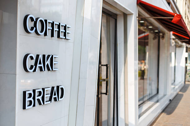 istock Restaurant cafe with door and window. Caption letters coffee, cake, bread 2232371400