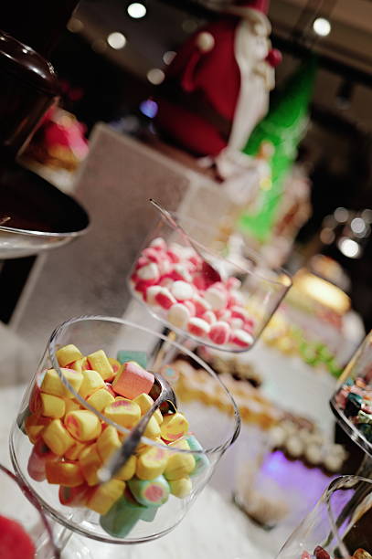 Close-up of vibrant candy in glass bowls. A festive scene filled with sweet treats and vivid colors, perfect for food and dessert-themed content.