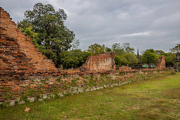 istock Ancient ruined brick wall in Buddhist temple, Thailand 2232372694