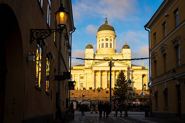 Christams tree at Senaatintori  square with the cathedral lit at sunset, Helsiniki, Finland