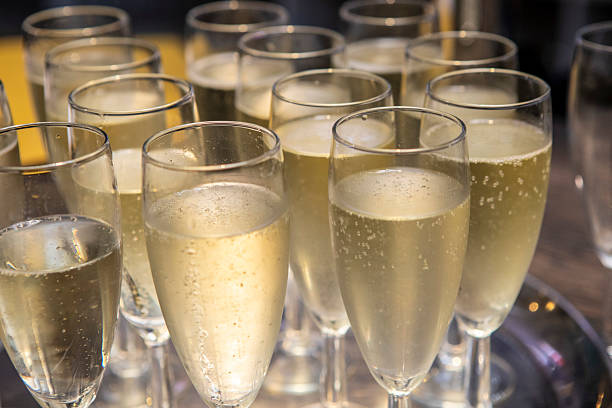 istock Champagne in glasses on a tray at a party celebration 2232375605