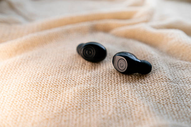 istock A pair of wireless headset on natural background 2232375948
