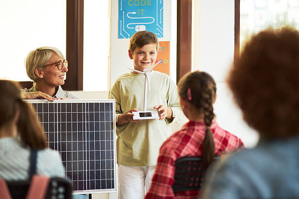 istock Caucasian Boy Demonstrating Solar Panel Technology to Diverse Teenage Students 2232376100